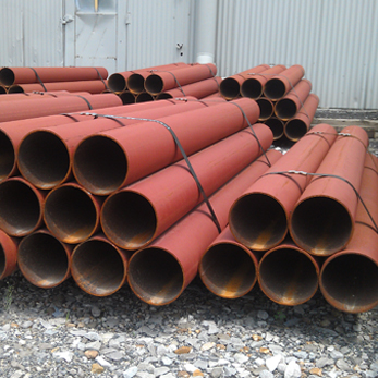 Raw steel materials and heavy metal components on site before Welders Ghana fabrication begins